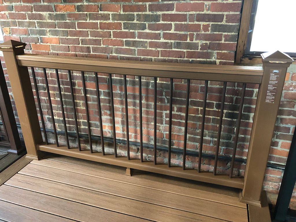 TREX TRANSCEND RAIL IN TREE HOUSE WITH SIGNATURE ROUND BALUSTERS AND