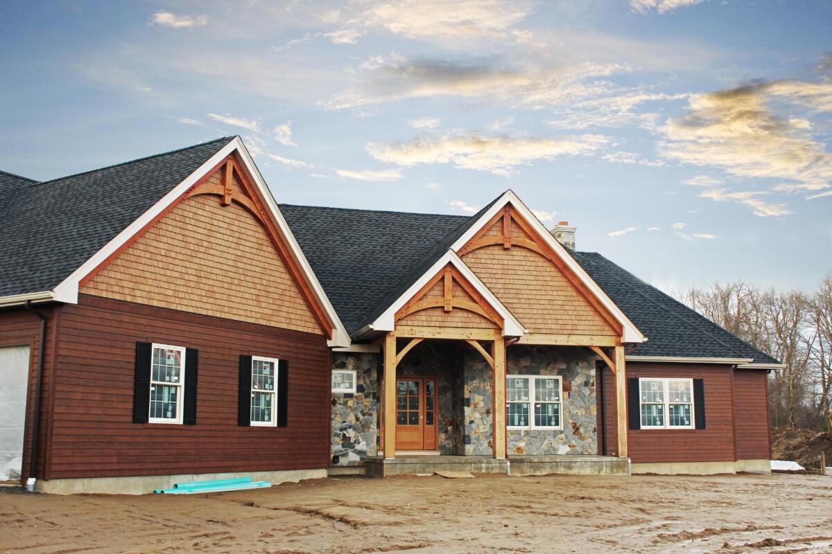 A beautiful new rustic home in Suffield, CT featuring Diamondkote LP Smartside