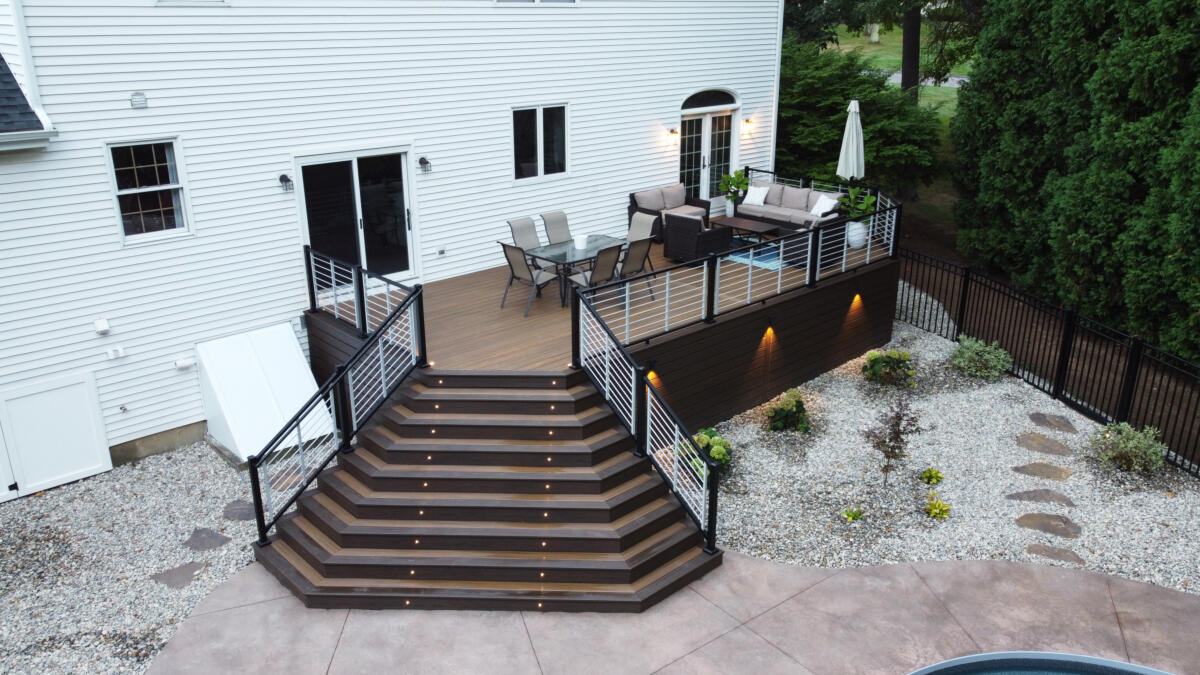 Maple Leaf Carpentry builds a custom Trex deck with a dramatic stairway